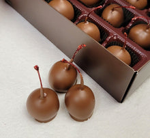 Load image into Gallery viewer, 16 Stemmed Maraschino Cherries wrapped in a creme blanket and then dipped in our creamy milk.
